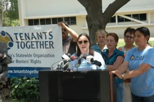 Simone Whalen-Rhodes, supported by community allies and residents, challenged the city of Fresno to hold slumlords accountable now. Photo by Mike Rhodes