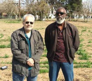 Community Alliance writer Leonard Adame with Golden Westside Planning Committee member Bob Mitchell at the Triangle property in southwest Fresno.
