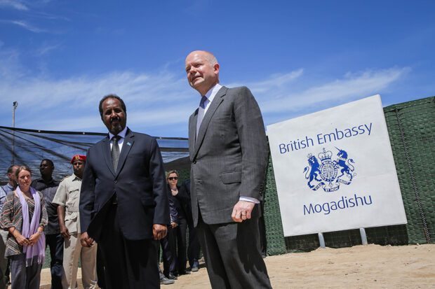 British Foreign Secretary William Hague stands with Somali President Hassan Sheikh Mohamud at the opening of the newly built British Embassy in the Somali capital of Mogadishu in 2013. The largest embassy-building boom in history recently took place in Africa, as more than 320 embassies were established from 2010 to 2016. Photo courtesy of The Commons