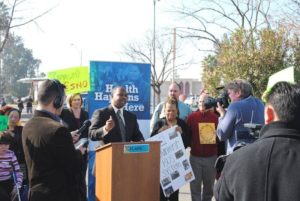 Community leaders spoke in support of an improved public transportation system at this press conference. Photo by Augie Blancas