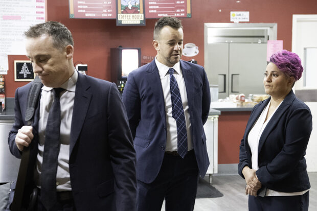 Former Bitwise CEOs Jake Soberal (center) and Irma Olguin Jr. (right) in the Federal Courthouse café just before their sentencing for wire fraud on Dec. 17. Photo by Peter Maiden