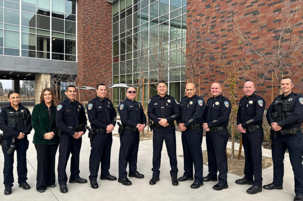 Clovis police officers pose for a photograph outside the Martin Luther King Jr. community breakfast held in January at California Health Sciences University. A June 2022 grand jury report criticized the department as “still very white.” Photo from the Clovis Police CA Facebook