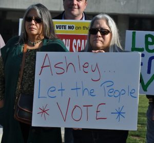 Holding the “Ashley Let the People Vote” sign is Gloria Hernandez. That was the primary message from the community and labor groups opposed to the privatization of the City of Fresno’s sanitation department. Photo by Howard Watkins