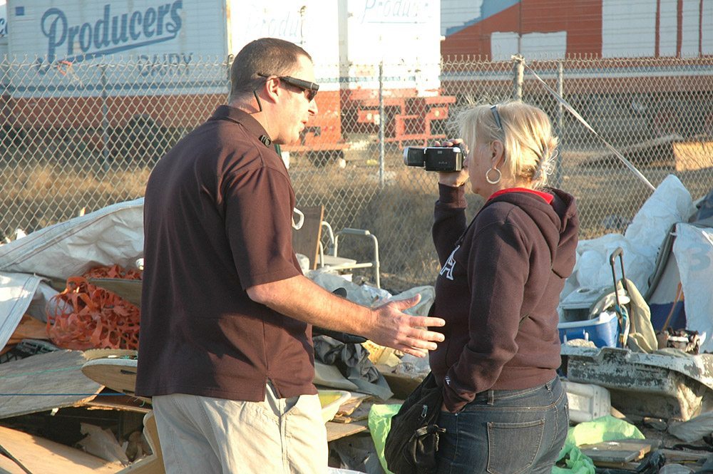 Fresno Police Department Sergeant Robert Dewey told ACLU organizer and Community Alliance newspaper editorial board member Pam Whalen to move back as she documented the demolition of the Grain Silo homeless encampment. Photo by Mike Rhodes