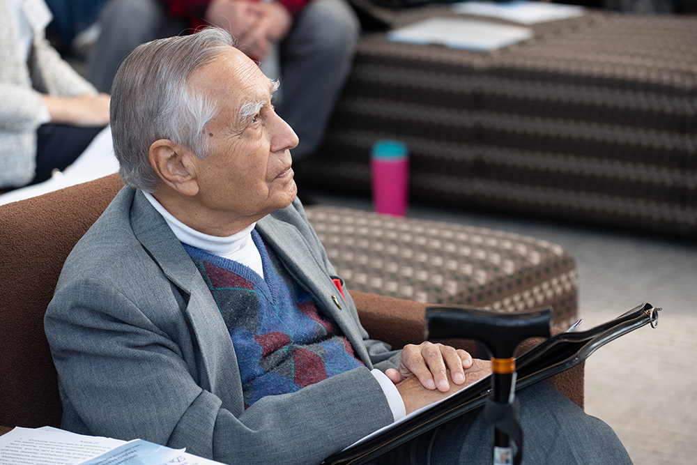 Dr. Sudarshan Kapoor listens to a speaker at an event in his honor on Dec. 7. Photo by Peter Maiden