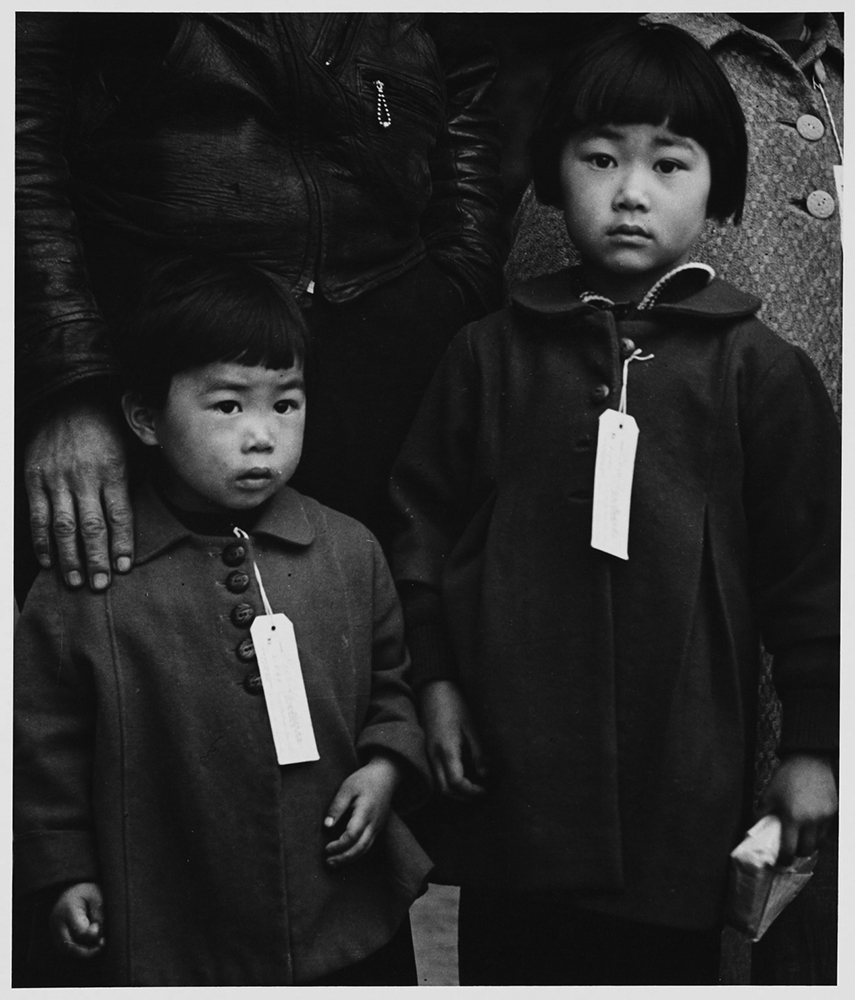 Two children of the Mochida family who, with their parents, await an evacuation bus in Centerville on May 8, 1942.