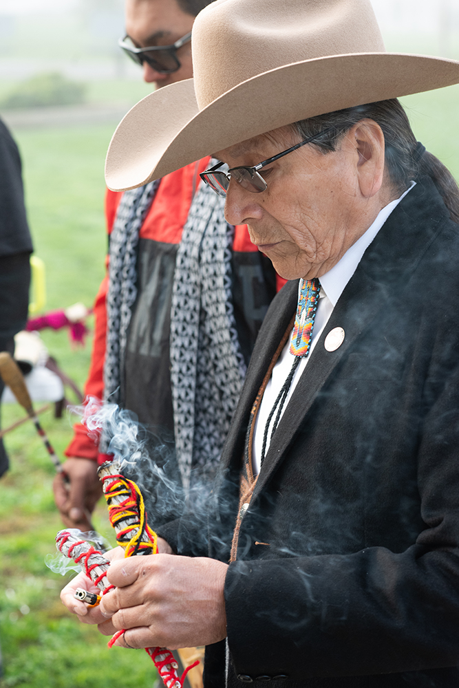 David Álvarez burns sage as part of a prayer circle for Douglas “Chief” Stankewitz in front of the Fresno County Courthouse on Jan. 29. Photo by Peter Maiden