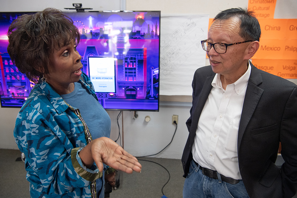 Marlene Jones Cannon talks with Dr. Raymond Chong after his lecture on the Lost Kinjo project. Photo by Peter Maiden