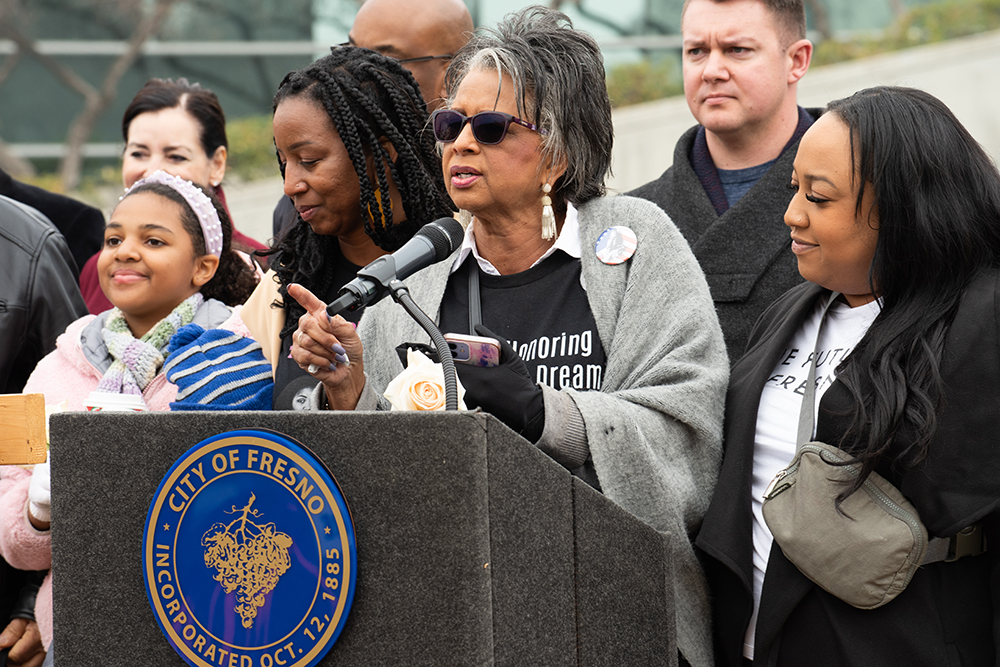 Terri Kimber Edwards, daughter of Les Kimber, the first Black City Council member in Fresno, speaks in front of City Hall to hundreds assembled to commemorate Dr. Martin Luther King Jr.’s birthday on Jan. 20. Photo by Peter Maiden