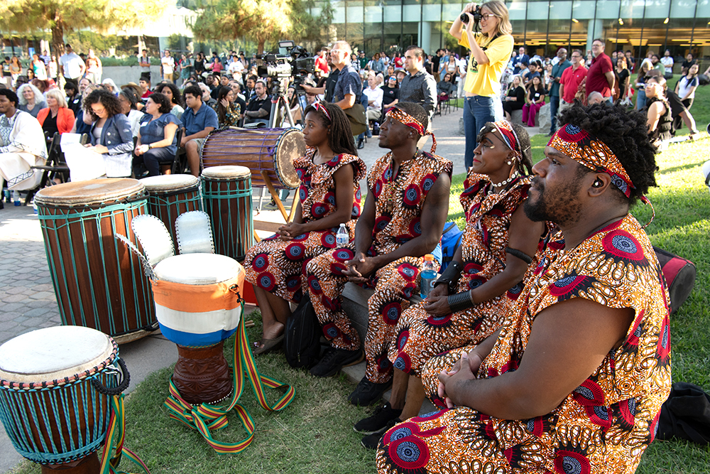 African drummers among those listening to speakers at the program for the unveiling of a Nelson Mandela statue at Fresno State. Photo by Peter Maiden