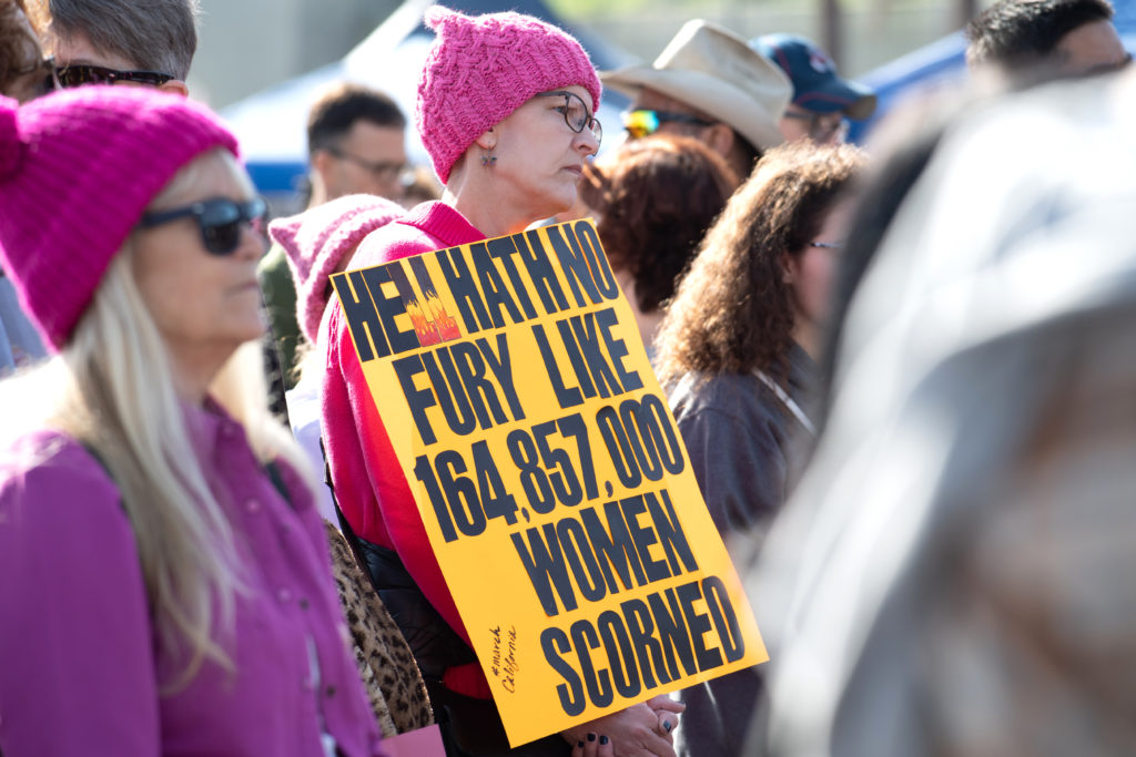 Women listen to speakers 