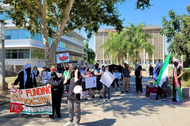 Never stop protesting, even if it’s hot! Photo by Bob McCloskey