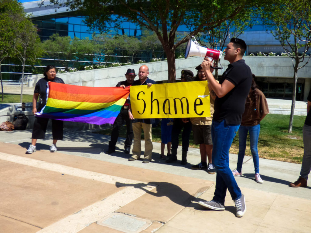 Martin Martinez, member of Gay Blood Rise and the Mexican American Political Association, leading a chant during the rally against the Sodomite Suppression Act.