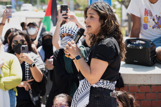 Haneen, spokesperson for a sit-in at Fresno State, speaks to the crowd. Photo by Peter Maiden