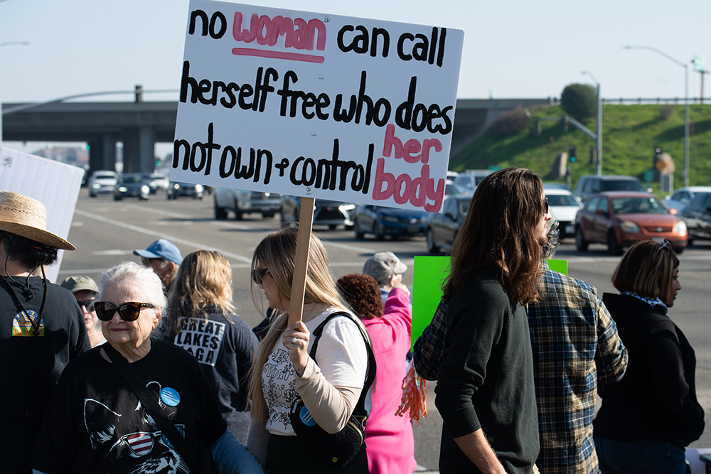 On Jan. 18, demonstrators gathered at the corner of Shaw and Chestnut avenues, outside the Save Mart Center, to protest the incoming administration in Washington, D.C. Photo by Peter Maiden