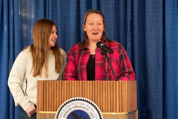 [Pre-Apprenticeship-4.jpg]Pre-apprenticeship graduate Alexis Rowberry, a single mother, was living in a shelter when she heard about the program. She is now a journeyman electrician. Her daughter was with her as she told her story. Photo by Peter Maiden