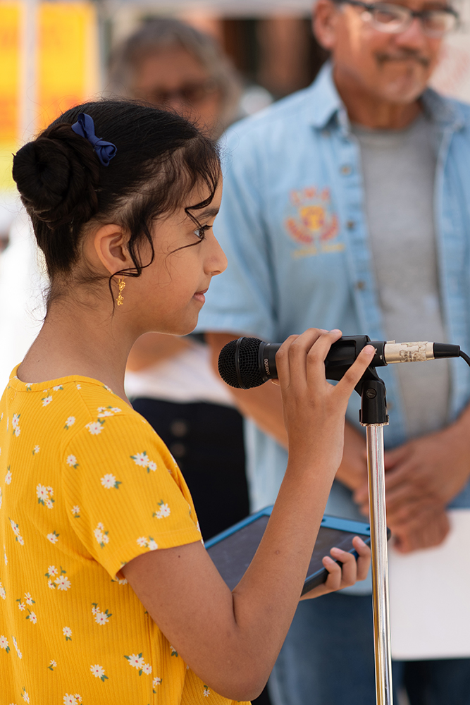 Juhayna, 10 years old, speaks to the media at a press conference and protest against Benjamin Netanyahu on July 24. In the background is Stan Santos of Raza Against War. Photo by Peter Maiden