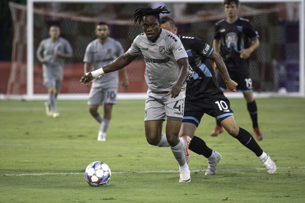 Central Valley Fuego’s Abdul Razak Cromwell advances the ball closely followed by Spokane’s Luis Gil. Cromwell is a native of Ghana. Photo by Peter Maiden