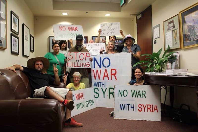 Protestors took their message of peace to Rep. Jim Costa’s office in downtown Fresno. Photo by Dylan Donnelly