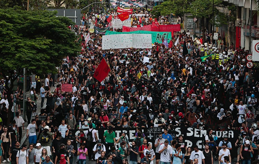 Thousands of people marched in Brazil protesting the millions spent on the World Cup and not on basic needs like housing and healthcare.