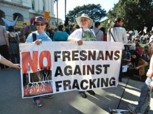 Fresno-area WILPF members Pat Wolk and Patty Bennett make their voices heard at the “Don’t Frack California” rally, held March 15 in Sacramento. Photo by Janet Scoll Johnson